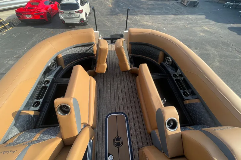 Slide: The Image of 2026 Harris Grand Mariner 230 SLDH boat interior with tan seating and modern design. - 8