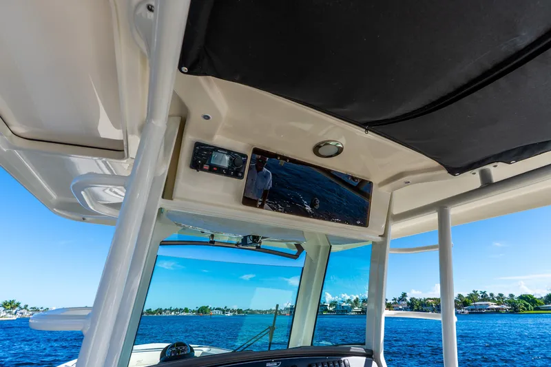 Slide: The Image of Interior view of 2022 Boston Whaler 330 Outrage boat with navigation equipment. - 44