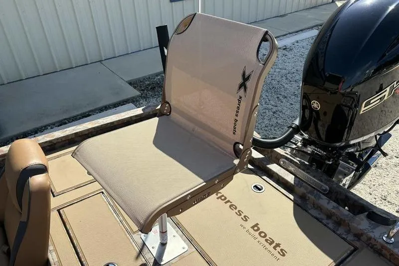 Slide: The Image of 2026 Xpress H20 Bass boat seat and motor, showcasing design and branding. - 13