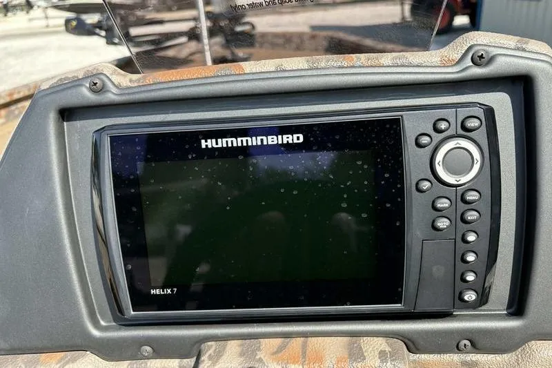 Slide: The Image of Humminbird Helix 7 fish finder on 2026 Xpress H20 Bass boat dashboard. - 15