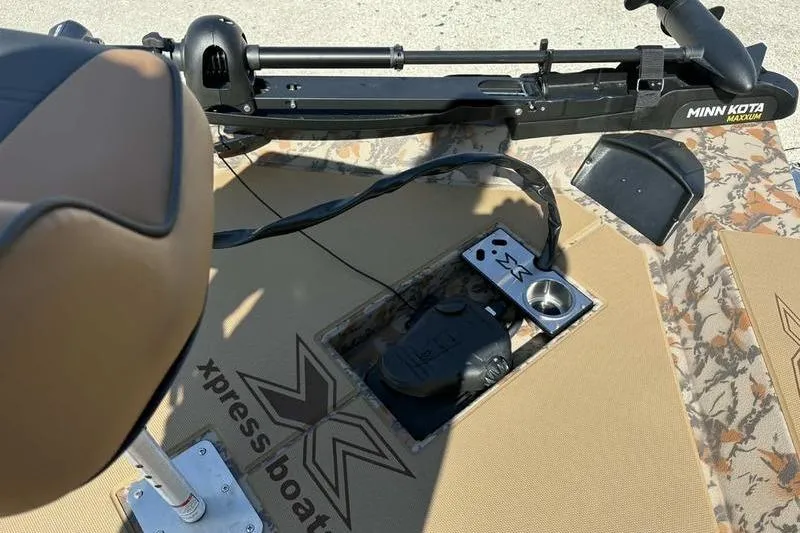 Slide: The Image of 2026 Xpress H20 Bass boat deck with Minn Kota trolling motor. - 16