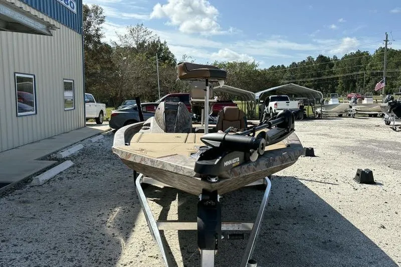 Slide: The Image of 2026 Xpress H20 Bass boat on trailer in outdoor dealership lot. - 17