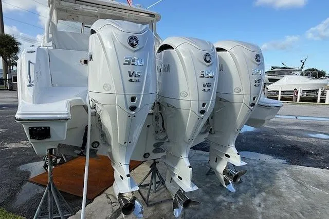 Slide: The Image of 2025 Pursuit DC 365 Dual Console with triple Yamaha 350 V6 outboard engines. - 4