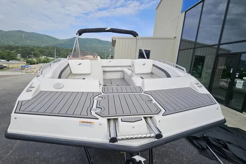 Slide: The Image of 2023 Starcraft SVX 171 OB boat with sleek design, docked outdoors. - 6