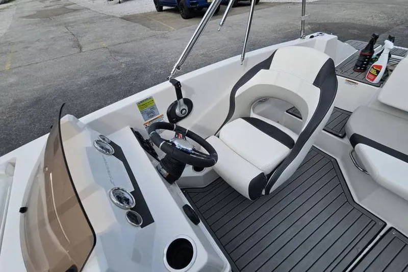 Slide: The Image of 2023 Starcraft SVX 171 OB boat interior with steering wheel and seating. - 8