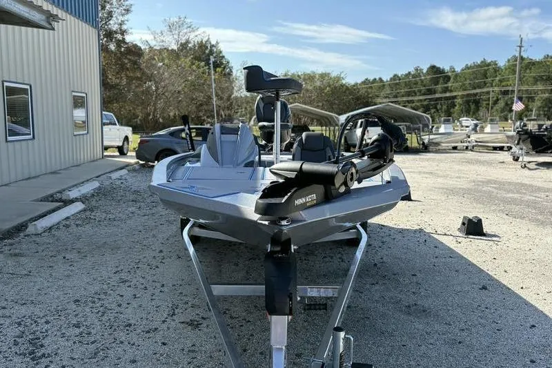 Slide: The Image of 2026 Xpress H20 Bass boat on trailer in outdoor dealership lot. - 13