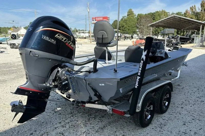Slide: The Image of 2026 Xpress H20 Bass boat with Yamaha engine on a trailer. - 3