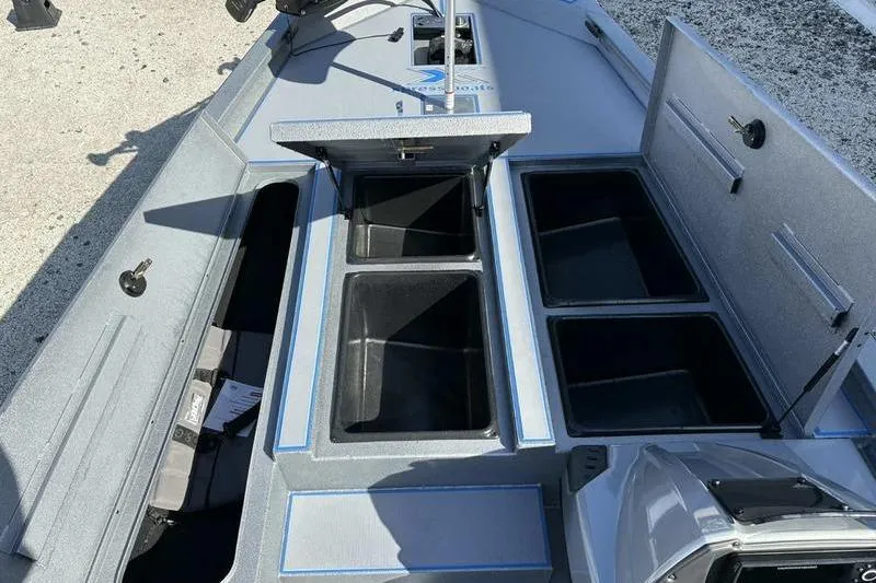 Slide: The Image of 2026 Xpress H20 Bass boat interior with open storage compartments. - 4