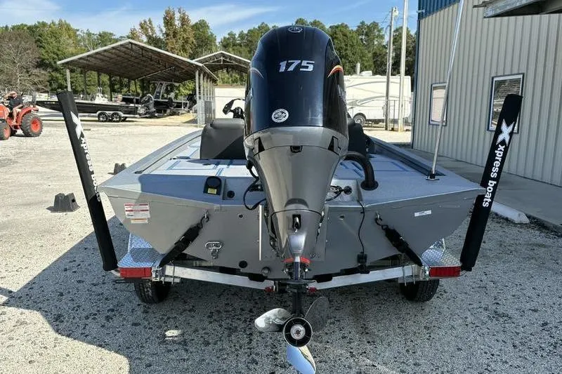Slide: The Image of 2026 Xpress H20 Bass boat with 175 horsepower engine, parked outdoors. - 8