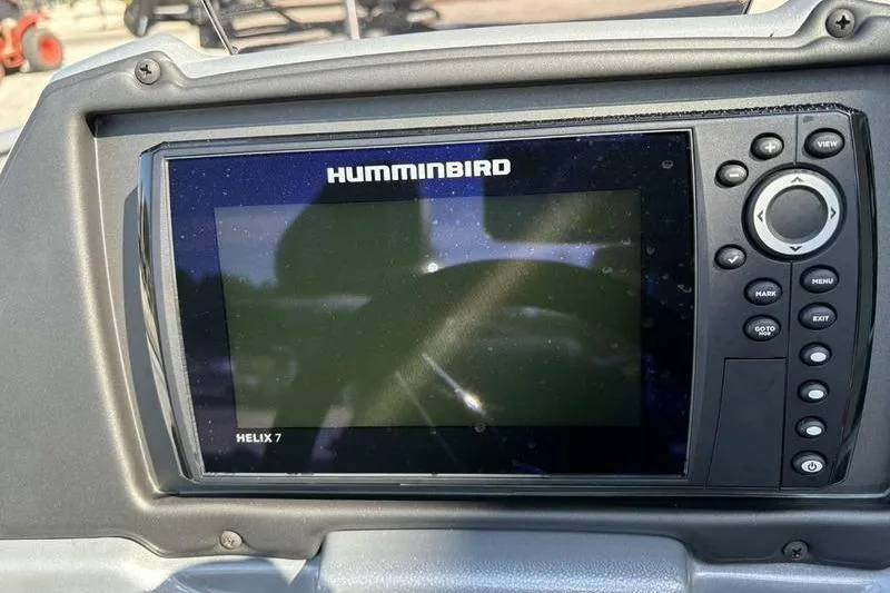 Slide: The Image of Humminbird Helix 7 fish finder on 2026 Xpress H20 Bass boat dashboard. - 9