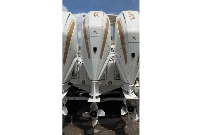 Slide: The Image of Triple outboard engines on a 2001 Donzi 32 VS boat, showcasing power and design. - 6