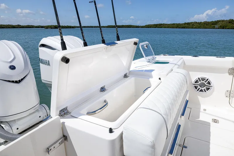 Slide: The Image of Manufacturer Provided Image: 2025 Pursuit OS 325 Offshore boat with Yamaha engines on a serene lake. - 16