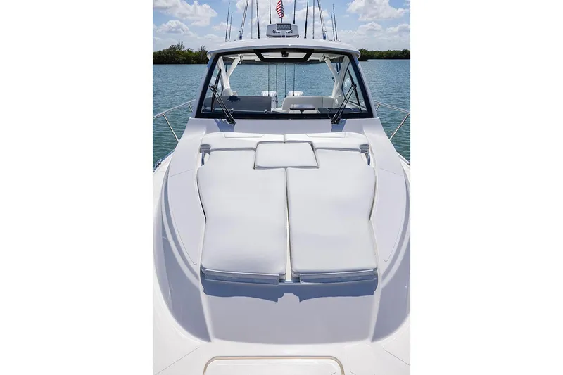 Slide: The Image of Manufacturer Provided Image: 2025 Pursuit OS 325 Offshore boat with spacious deck and comfortable seating. - 9