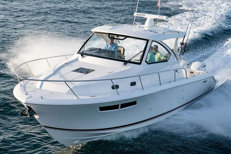 The Image of Manufacturer Provided Image: 2025 Pursuit OS 355 Offshore boat cruising on open water. - 0