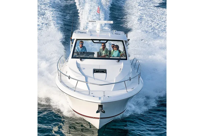 Slide: The Image of Manufacturer Provided Image: 2025 Pursuit OS 355 Offshore boat cruising on water with passengers. - 3