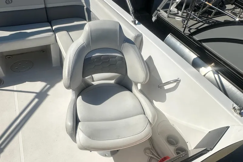 Slide: The Image of Captain's chair on 2022 Hurricane Sundeck Sport 218 OB boat, featuring sleek design and comfortable seating. - 14