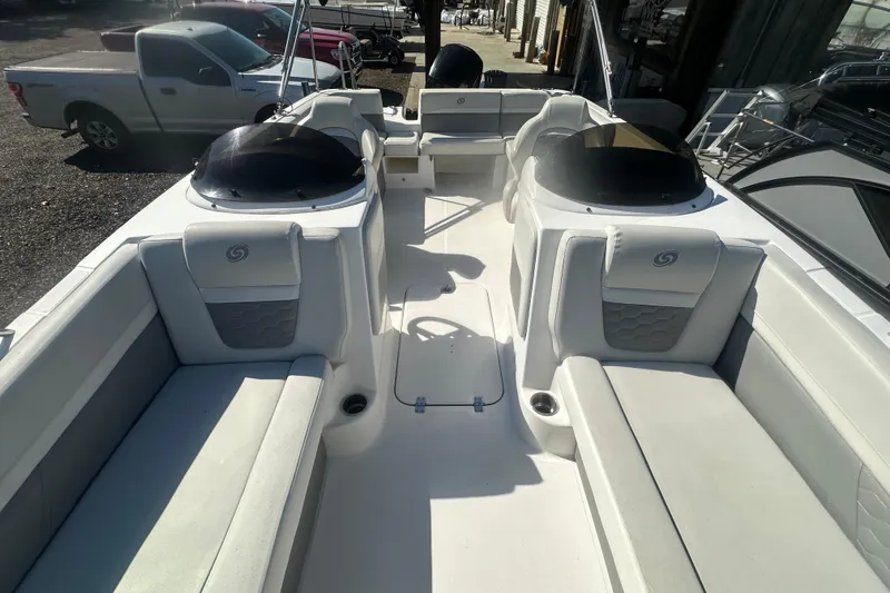 Slide: The Image of 2022 Hurricane Sundeck Sport 218 OB boat interior with spacious seating and modern design. - 18