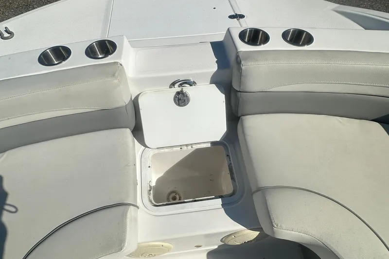 Slide: The Image of 2022 Hurricane Sundeck Sport 218 OB boat interior with seating and cup holders. - 19