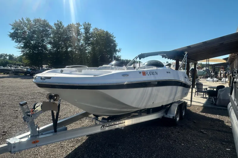 Slide: The Image of 2022 Hurricane Sundeck Sport 218 OB boat on trailer, parked outdoors. - 5