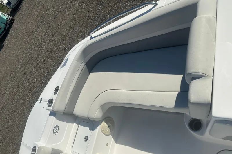 Slide: The Image of 2022 Hurricane Sundeck Sport 218 OB boat interior with white cushioned seating. - 8