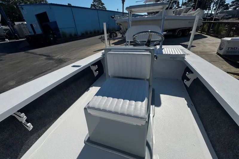 Slide: The Image of 2026 Mitzi Skiffs 17 Tournament boat interior with seating and steering wheel. - 15
