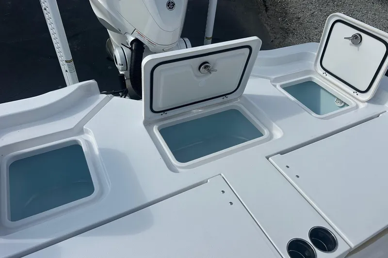 Slide: The Image of 2025 Sportsman Masters 267 Bay Boat with open storage compartments and sleek design. - 15