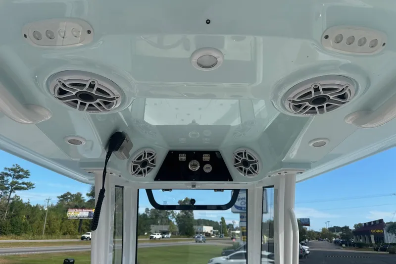 Slide: The Image of 2025 Sportsman Masters 267 Bay Boat interior with speakers and control panel. - 6