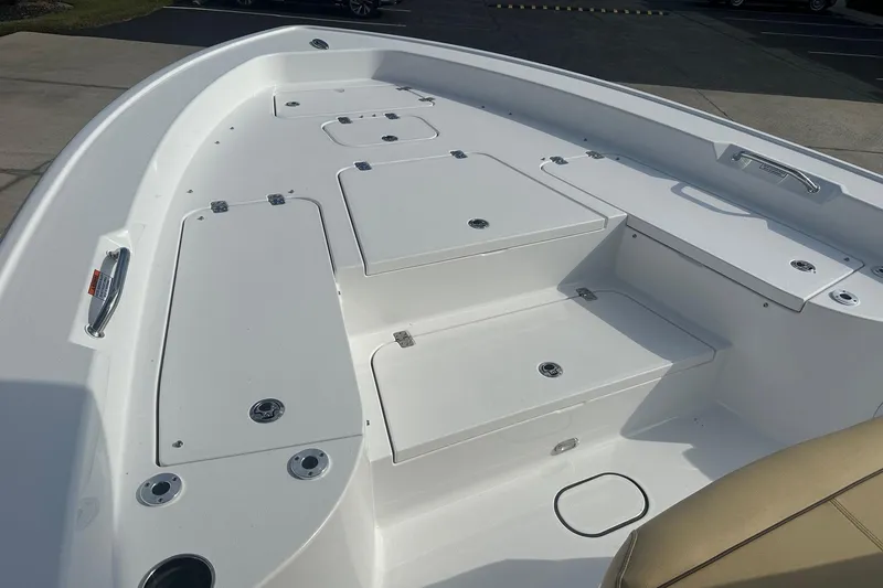 Slide: The Image of 2025 Sportsman Masters 267 Bay Boat deck with storage compartments and seating. - 7