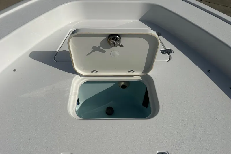 Slide: The Image of Open storage compartment on 2025 Sportsman Masters 267 Bay Boat deck. - 8