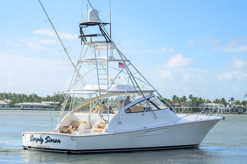 Slide: The Image of 2015 Viking 52 Open yacht cruising near Palm Beach, Florida, under clear skies. - 11