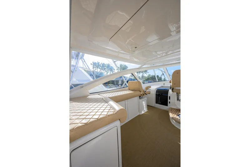 Slide: The Image of Interior of 2015 Viking 52 Open yacht with beige seating and modern design. - 21