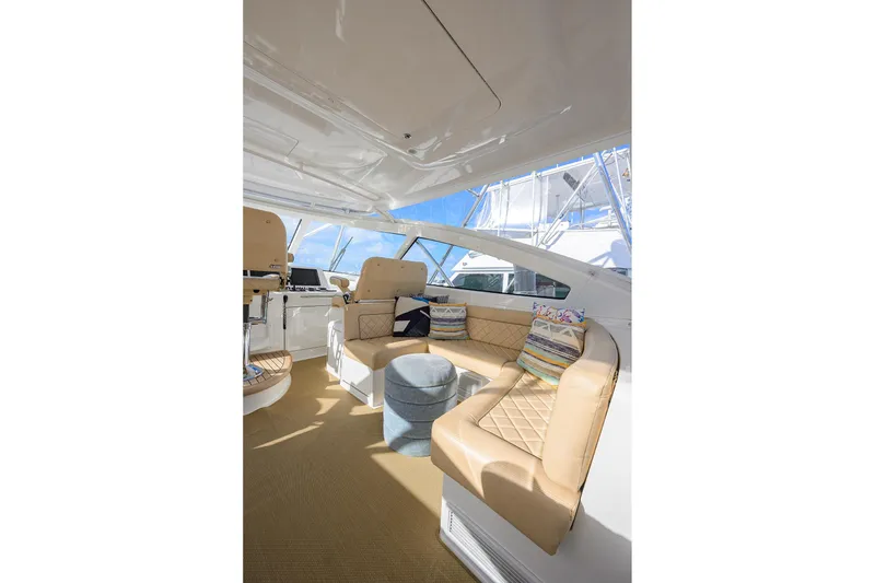 Slide: The Image of Luxurious interior of 2015 Viking 52 Open yacht with beige seating and helm station. - 23