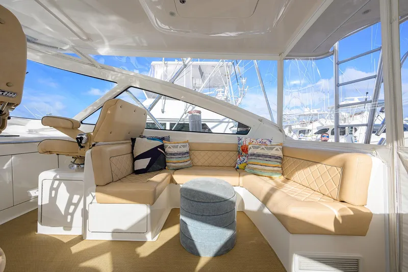 Slide: The Image of Luxurious interior of 2015 Viking 52 Open yacht with beige seating and colorful cushions. - 25