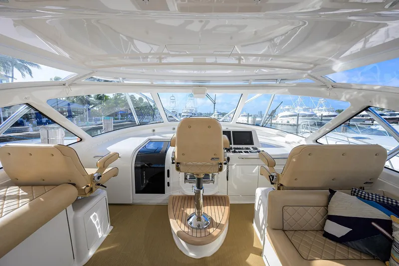 Slide: The Image of Interior view of 2015 Viking 52 Open yacht cockpit with luxurious seating and navigation controls. - 28