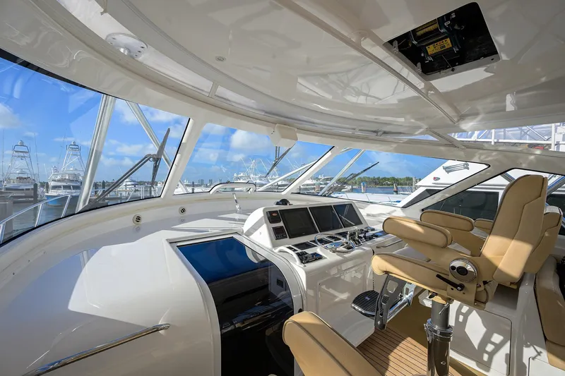 Slide: The Image of Interior view of 2015 Viking 52 Open yacht cockpit with modern controls and seating. - 29