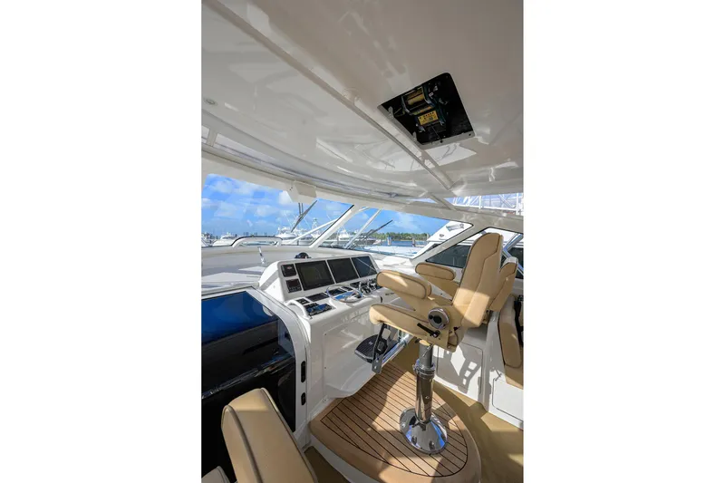 Slide: The Image of Interior of 2015 Viking 52 Open yacht with helm station and luxurious seating. - 30