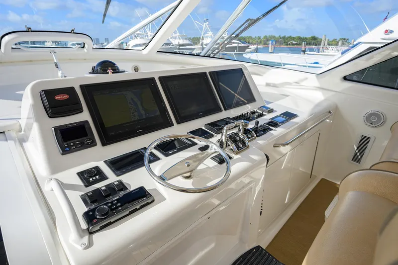 Slide: The Image of 2015 Viking 52 Open yacht helm with advanced navigation displays and controls. - 31