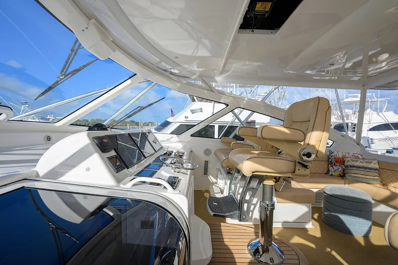 Slide: The Image of Interior of 2015 Viking 52 Open yacht with luxurious seating and modern navigation controls. - 35