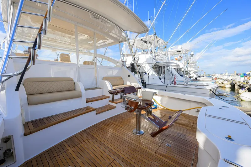 Slide: The Image of 2015 Viking 52 Open yacht with teak deck and seating at marina. - 38