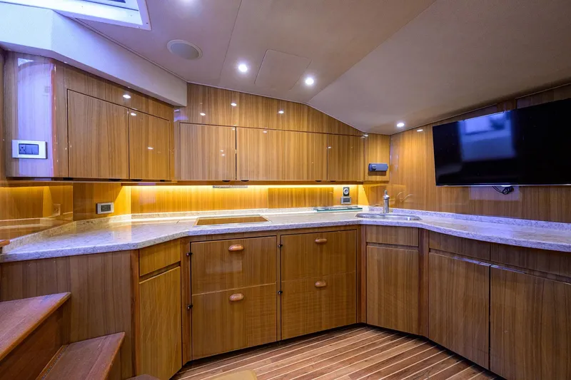 Slide: The Image of Luxurious interior of 2015 Viking 52 Open yacht with modern kitchen and sleek wood finish. - 44