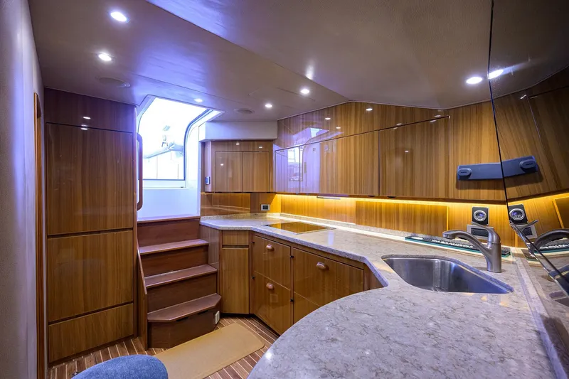 Slide: The Image of Luxurious interior of 2015 Viking 52 Open yacht with modern kitchen and wooden cabinetry. - 46