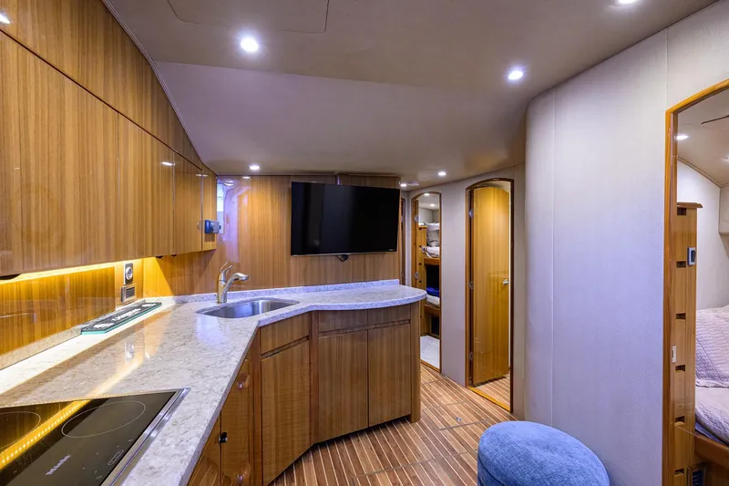 Slide: The Image of Luxurious interior of 2015 Viking 52 Open yacht with modern kitchen and cozy living space. - 47