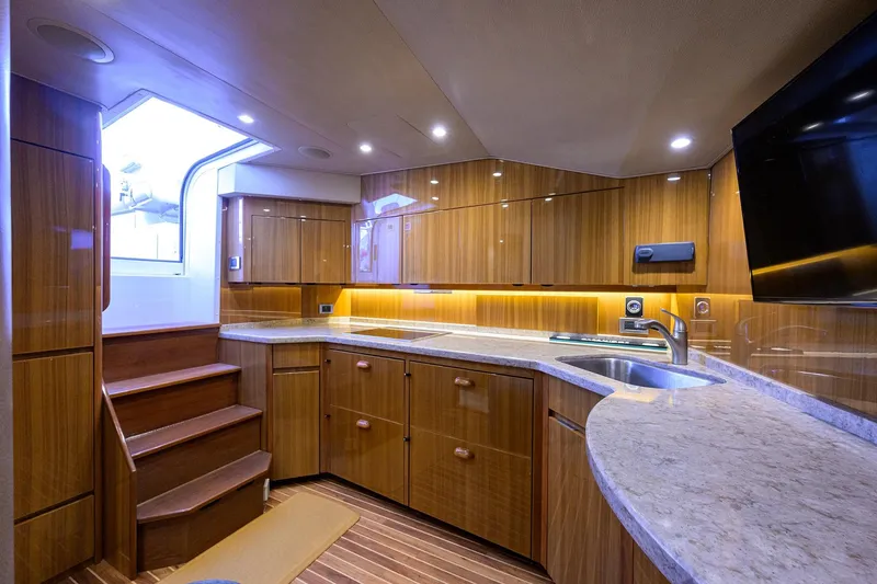 Slide: The Image of Luxurious interior of 2015 Viking 52 Open yacht with modern kitchen and elegant wood finishes. - 51