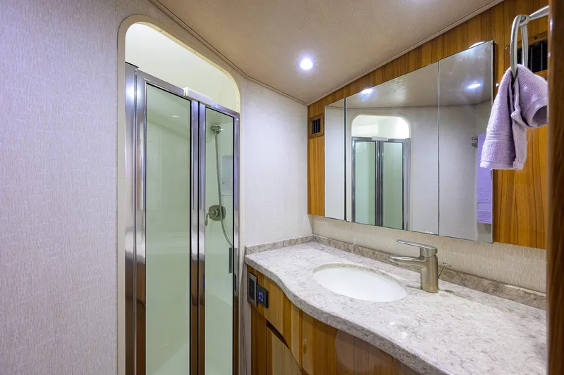 Slide: The Image of Luxurious bathroom in 2015 Viking 52 Open yacht with modern fixtures and shower. - 52