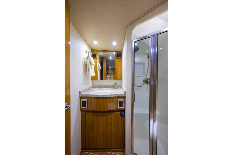Slide: The Image of Luxurious bathroom in 2015 Viking 52 Open yacht with modern shower and vanity. - 53