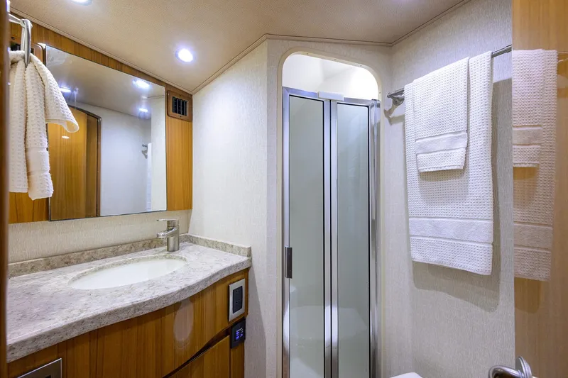 Slide: The Image of Luxurious bathroom in 2015 Viking 52 Open yacht with modern fixtures and elegant design. - 56