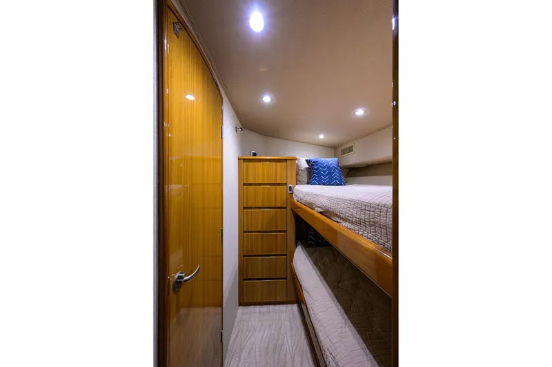Slide: The Image of Interior of 2015 Viking 52 Open yacht with bunk beds and wooden cabinetry. - 64