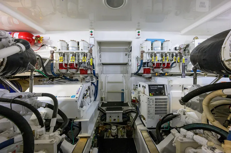 Slide: The Image of Engine room of 2015 Viking 52 Open yacht, featuring Seakeeper and Cummins Onan generator. - 69