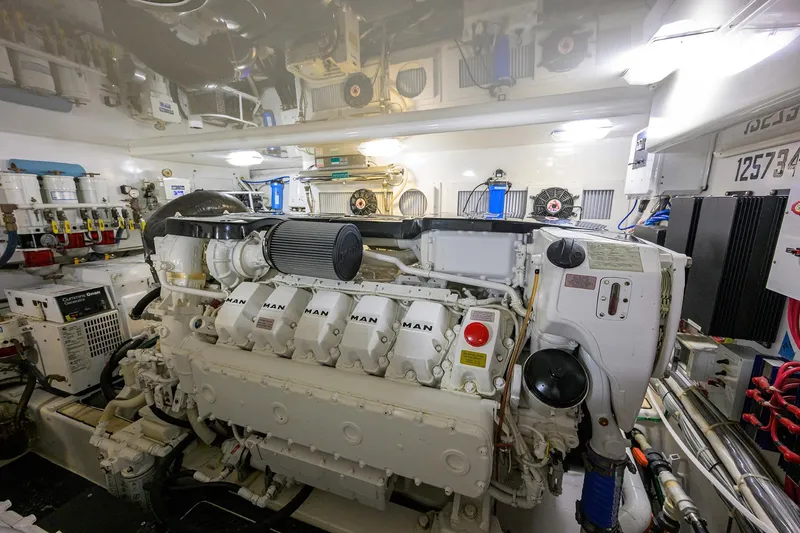 Slide: The Image of Engine room of a 2015 Viking 52 Open yacht, featuring a MAN engine. - 73