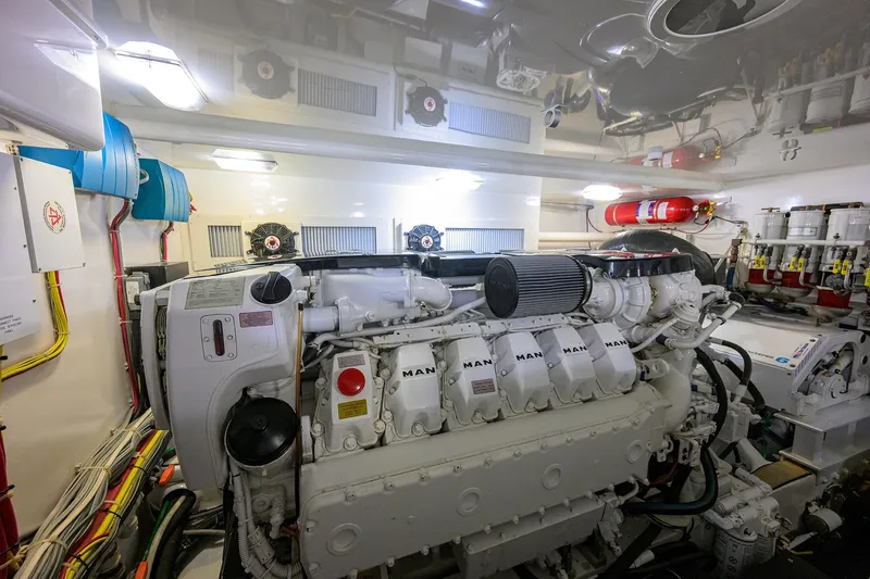 Slide: The Image of Engine room of a 2015 Viking 52 Open yacht, featuring a MAN engine. - 74